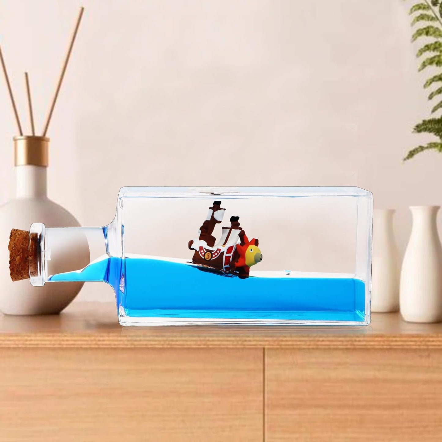 Unsinkable Thousand Sunny Pirate Ship in a Bottle - Thousand Sunny Drift Bottle Liquid Wave Pirate Ship Decor, Unsinkable Boat in a Box is Suitable for Desk Decor Display Cases and Gifts.