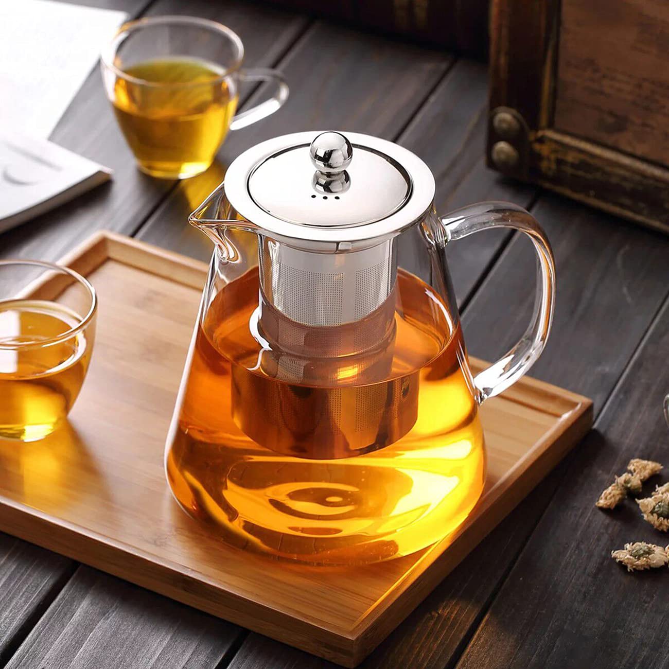 transparent glass teapot with strainer